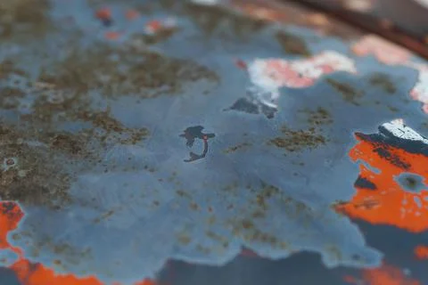 Closeup of Surface peeling old car paint cracked with rusty background Stock Photos