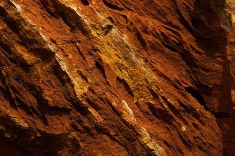 A closeup surface of red lava textured rocks Stock Photos