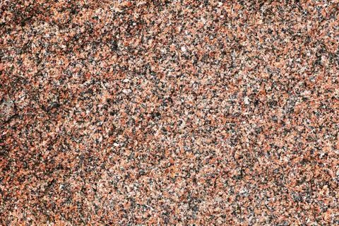 Closeup of surface reddish granite block Stock Photos