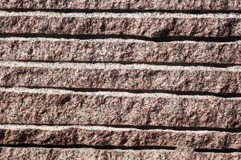 Closeup of surface reddish granite block Stock Photos