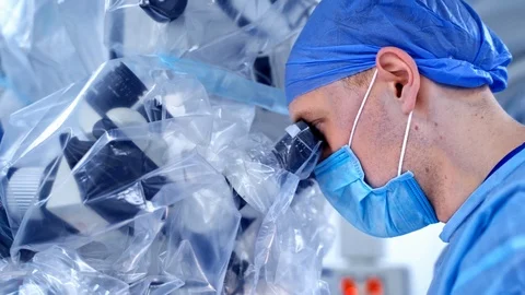 Closeup of a surgeon with operating microscope. Health care concept. Stock Footage 119154087
