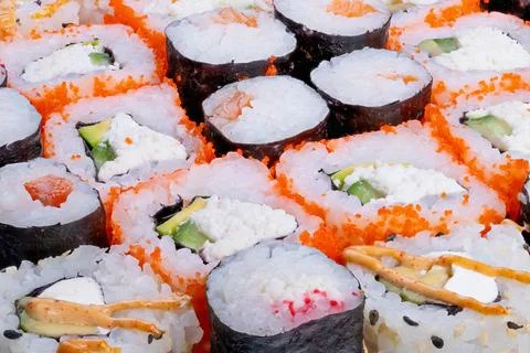 Closeup sushi rolls showcasing chef craft, handrolled texture and precise cuts, Stock Photos