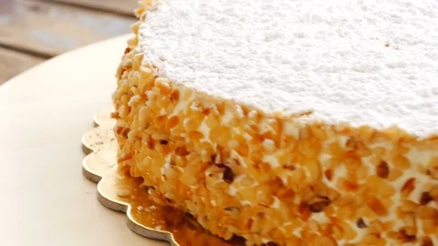 Closeup of sweet hazelnuts cake turning presentation Stock-Footage 83372159