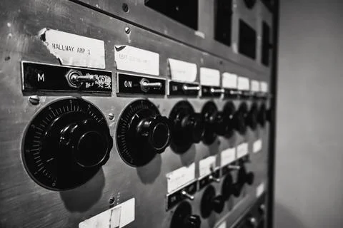 Closeup of switches and knobs on an antique control panel Foto stock