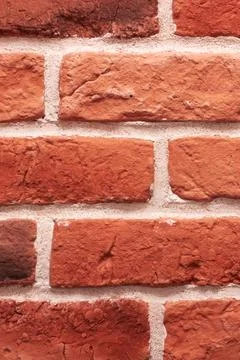 Closeup of a symmetrical pattern of brown brickwork rectangles 스톡 사진