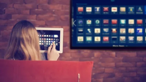 Closeup of a tablet is connected to a smart TV. 動画素材 72955610