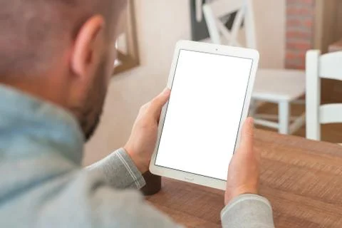 Closeup tablet in man hands. Vertical position. Isolated screen for mockup pr Stock Photos