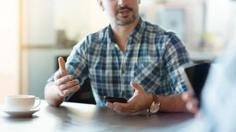 Closeup of a talking man at cafe. Stock Photos