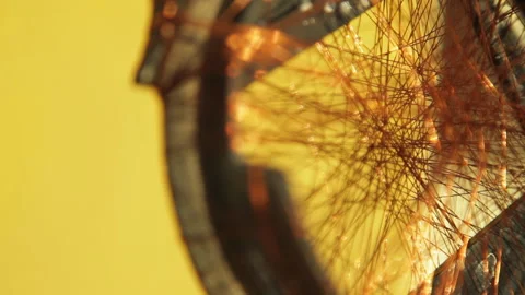 Closeup of a tangled mess of copper wire on a small tire creating a dream filter Stock Footage
