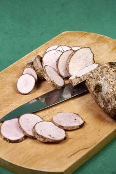 Closeup of taro root vegetable, eddo malanga, green background Stock Photos