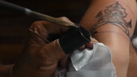 The closeup of the tattooing process Stock Footage 146493286