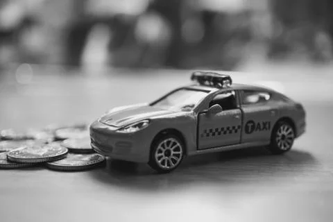 Closeup taxi with stack coins Stock Photos