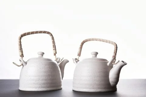 Closeup of tea set on white background. Stock Photos