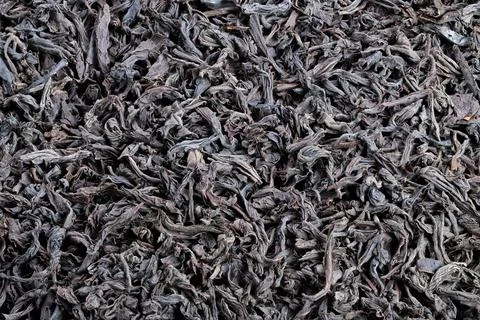 Closeup of tea, Sharp image highlighting structure and color of black tea leaves Stock Photos