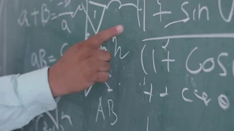 Closeup Of Teacher Hand Pointing  Math Formulas On Blackboard, 4k Stock Footage 134357417
