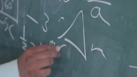 Closeup Of Teacher Hand Writing Math Formulas With Chalk On Blackboard, 4k Stock Footage 134357319