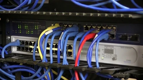 Closeup of technician's hands wiring a computer router Stock-Footage 78253251