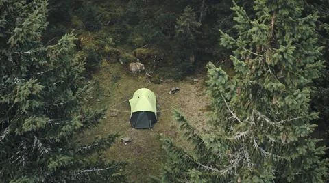 Closeup tent at pine trees forest aerial. Autumn nobody nature landscape Stock Photos