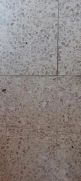 Closeup of terrazzo stone tile surface with speckled texture pattern Stock Photos