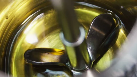Closeup test tool put into liquid sample begins to turn Stock Footage 93782502