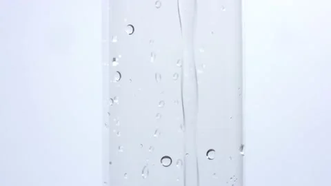 Closeup of test tube section being filled with solution in pharmaceutical tr Stock Footage 146478981