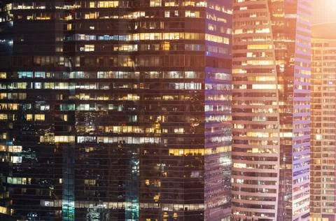 Closeup texture and pattern of glasses window in building at night. Stock Photos