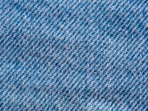 Closeup texture background of light blue denim fabric Stock Photos