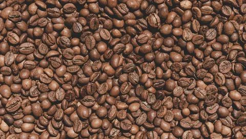 Closeup texture of coffee beans on the table. Coffe background Foto stock
