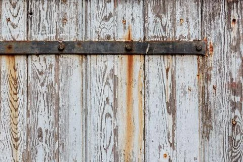 Closeup texture of old white door with weathered peeling paint Stock Photos