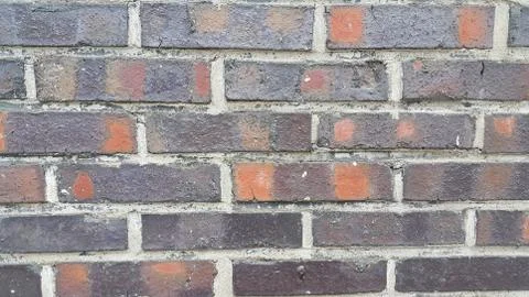 Closeup texture of red brick wall. A background of a weathered old exterior b Stock Photos