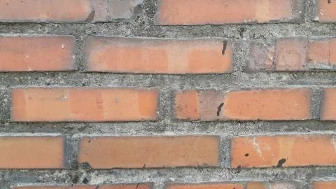 Closeup texture of red brick wall. A background of a weathered old exterior b Foto stock