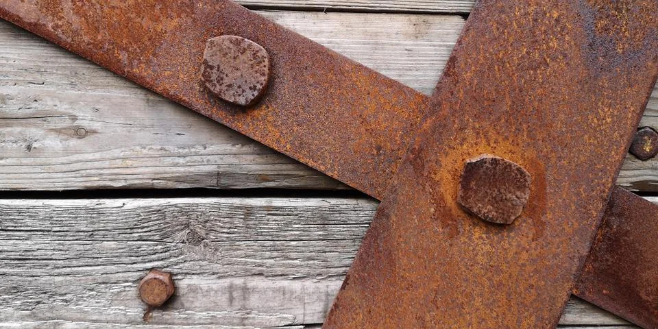 Closeup texture of rusty iron sheets bolted to aged wooden planks.Wallpaper Stock Photos