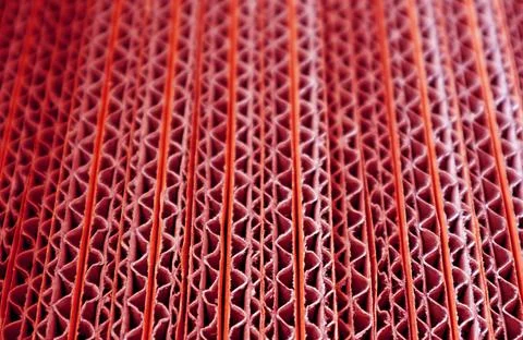 Closeup Texture of Unfold Red colored Corrugated Paper Boxes Stack Stockfoto's
