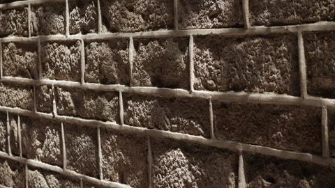 Closeup of a textured stone wall, rich in detail, ideal for artistic and Stock Footage 280587409