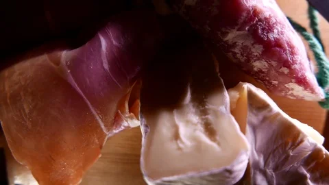 Closeup of thin slices of pork ham on the dish with cheese and greens. 4K UHD 動画素材 73047514