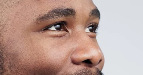 Closeup, thinking and man with ideas, eyes or problem solving on a white studio Stock Footage 248771318