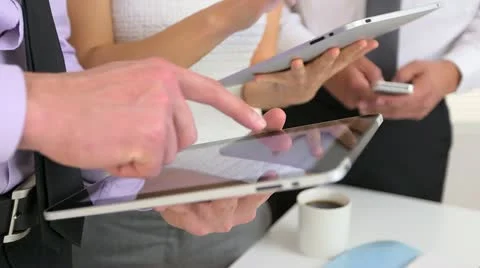 Closeup of three business people using tablets 库存影片 21950016