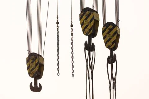 Closeup of three crane hooks of a heavy duty crane Foto stock