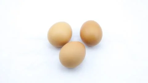 Closeup three egg on white background Stock Photos