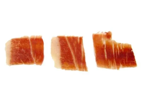 Closeup of three serrano ham slices isolated on white background. Jabugo Stock Photos