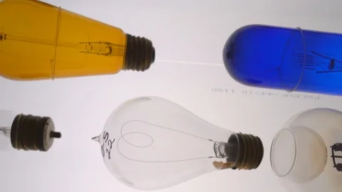 Closeup tilt of various light bulbs in a science lab Stock Footage 111119110