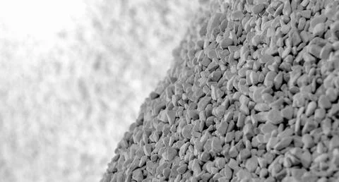 Closeup of a tiny stone texture surface against blurred background Stockfoto's