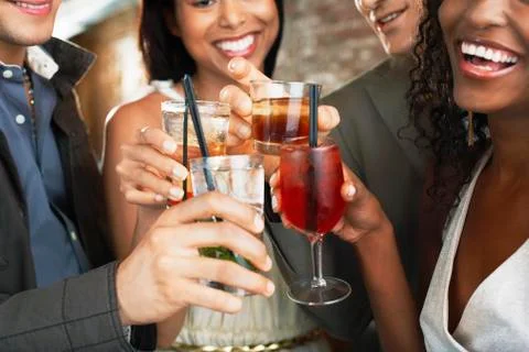 Closeup Of Toasting Drinks At Bar Stock Photos