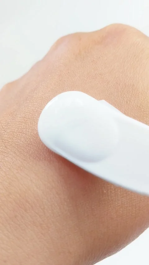 Closeup of tool dispensing moisturizer onto hand skin. Vertical footage for.. Stock Footage 336238665