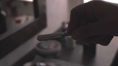 Closeup tool razor disinfection with the help of a roasting fire in the Video stock 107653865
