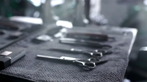Closeup of tools, scissors, comb and razor in barber shop 库存影片 62947014