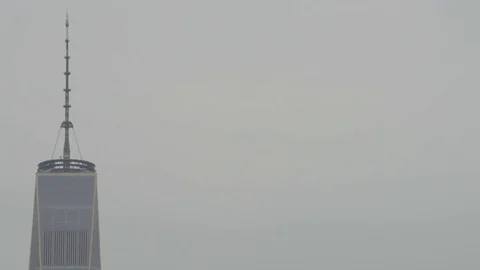 Closeup of Top of New York's World Trade Center on Overcast Day (Negative Space) Stock Footage 76648873