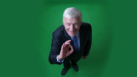 Closeup top shoot view of old caucasian businessman in a suit showing okay Video stock 108775823