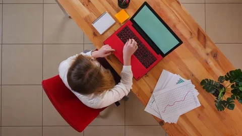 Closeup top shoot of young caucasian businesswoman using the laptop and taking Stock Footage 107363003