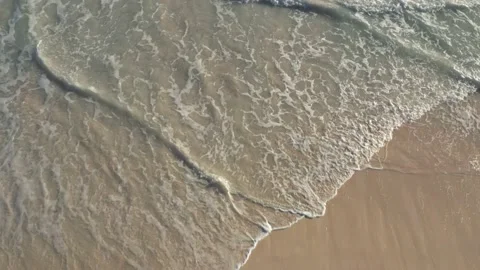 Closeup top shot of ocean surface, water and sand Stock Footage 130516066